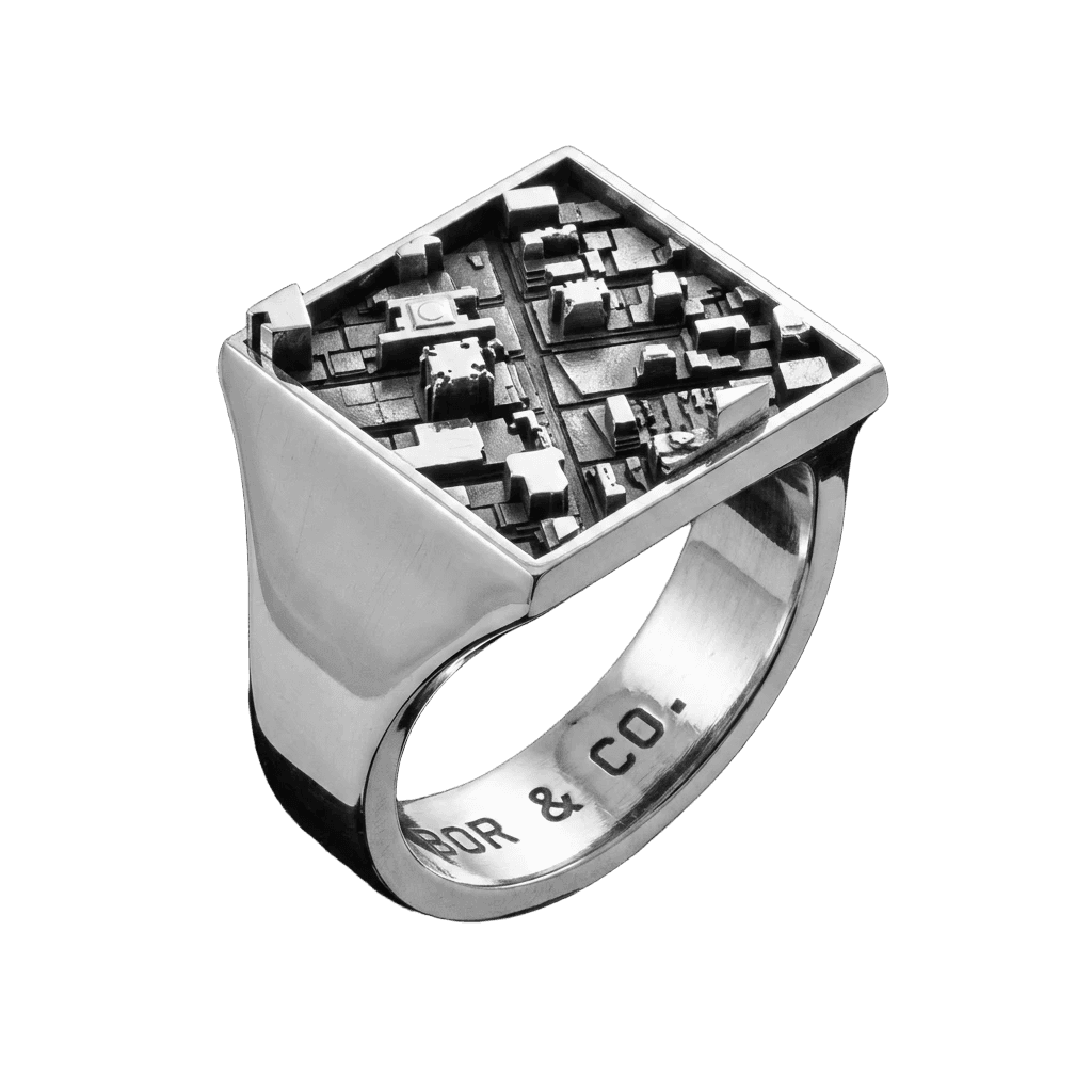 925 sterling silver square signet ring with Midtown Manhattan building relief on the table, mirror-polished finish, background removed.