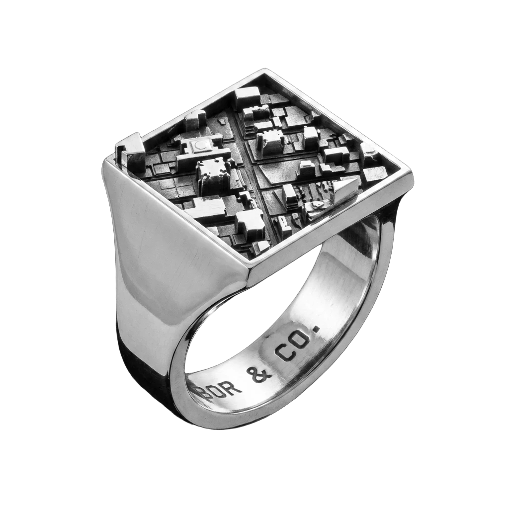 925 sterling silver square signet ring with Midtown Manhattan building relief on the table, mirror-polished finish, background removed.